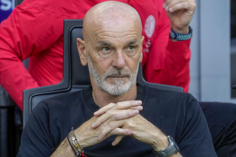 AC Milan's manager Stefano Pioli looks out from the bench prior a Serie A soccer match between AC Milan and Genoa, at the San Siro stadium in Milan, Italy, Sunday, May 5, 2024. (AP Photo/Luca Bruno)