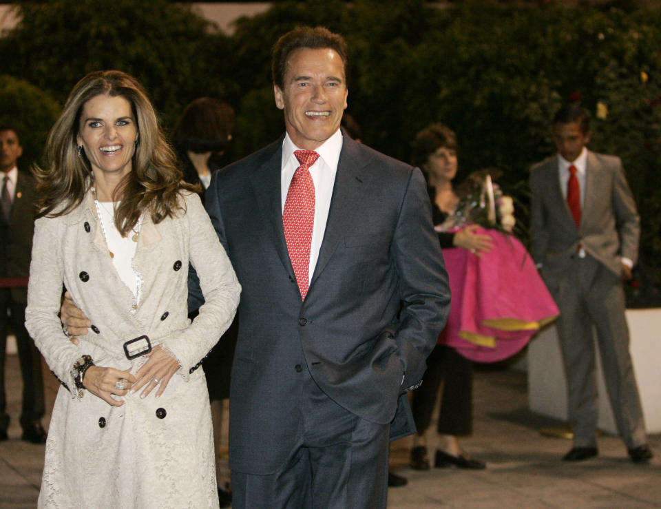 FILE - California Gov. Arnold Schwarzenegger arrives in Mexico City, Mexico, with first lady Maria Shriver on Wednesday, Nov. 8, 2006. Schwarzenegger and Shriver’s marriage is officially over more than 10 years after the award-winning journalist petitioned to end her then-25-year marriage to the action star and former California governor. A Los Angeles judge finalized the divorce on Tuesday, Dec. 28, 2021, court records show.(AP Photo/Marcio Jose Sanchez, File)