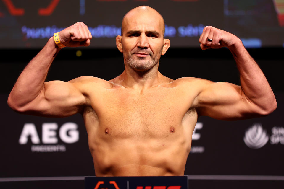 Former UFC light heavyweight champion Glover Teixeira poses on the scale ahead of a title fight against Jiri Prochazka at UFC 275. (Yong Teck Lim/Getty Images)