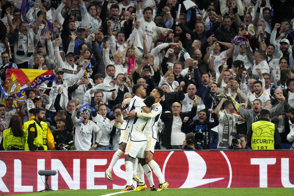 Real Madrid's Rodrygo celebrates scoring his side's second goal during the Champions League quarterfinal first leg soccer match between Real Madrid and Manchester City at the Santiago Bernabeu stadium in Madrid, Spain, Tuesday, April 9, 2024. (AP Photo/Manu Fernandez)