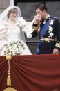 <p>With his wife, Princess Diana, on the balcony of Buckingham Palace on their wedding day. </p>