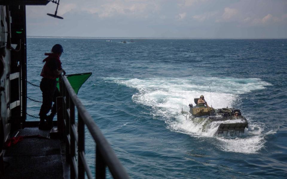 US Marine Corps have released this photo of AAV-P7/A1 Assault Amphibian Vehicles with the 22nd Marine Expeditionary Unit during training in the Atlantic Ocean in 2018 - SGT. ANDREW OCHOA/US MARINE CORPS/AFP