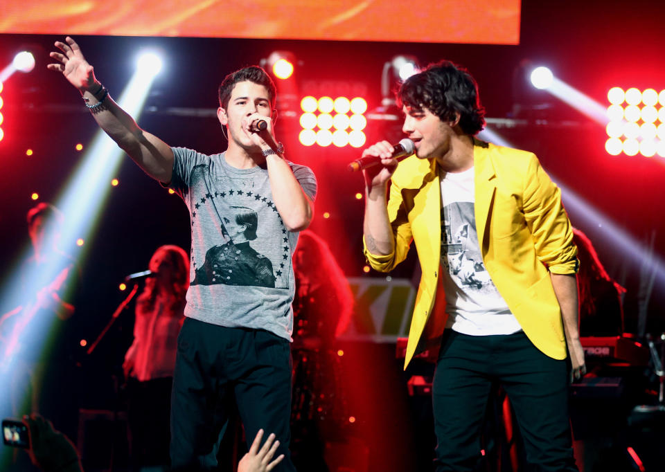 LOS ANGELES, CA - DECEMBER 01:  Musicians Nick Jonas (L) and Joe Jonas of the Jonas Brothers perform onstage during KIIS FM's 2012 Jingle Ball at Nokia Theatre L.A. Live on December 1, 2012 in Los Angeles, California.  (Photo by Christopher Polk/Getty Images for Clear Channel)