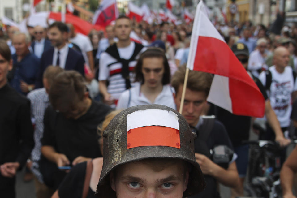 Supporters of the far-right organization National-Radical Camp, ONR, take part in the commemoration of the 1944 Warsaw Uprising, in Warsaw, Poland, Monday Aug. 1, 2022. Poles are marking the 78th anniversary of the Warsaw Uprising, a doomed revolt against Nazi German forces during World War II. (AP Photo/Michal Dyjuk)