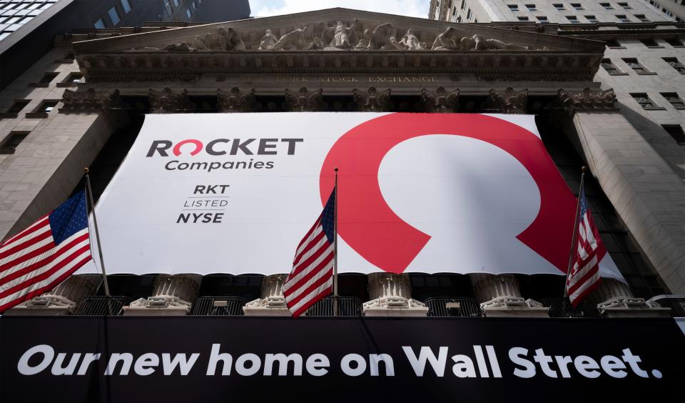 A Rocket Companies sign is displayed on the exterior of the New York Stock Exchange, Thursday, Aug. 6, 2020, in New York. Shares of Rocket Companies, parent of Quicken Loans, began trading Thursday during the Detroit company's IPO at the NYSE. Quicken is the largest retail mortgage originator in the U.S. (AP Photo/Mark Lennihan)