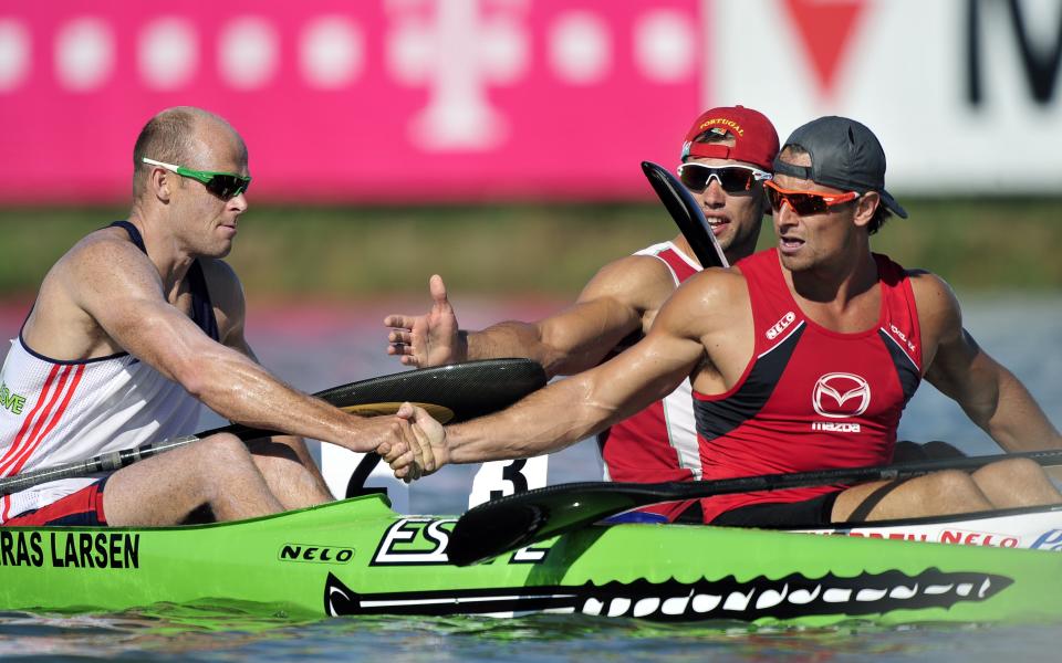 Canada's Adam van Koeverden celebrates his victory at the finish line of men's K1 1000m final after winning the men's K1 1000m final of the 39th ICF Flatwater world championships at the Matyeri Lake of Szeged on August 19, 2011. AFP PHOTO / ATTILA KISBENEDEK (Photo credit should read ATTILA KISBENEDEK/AFP/Getty Images)