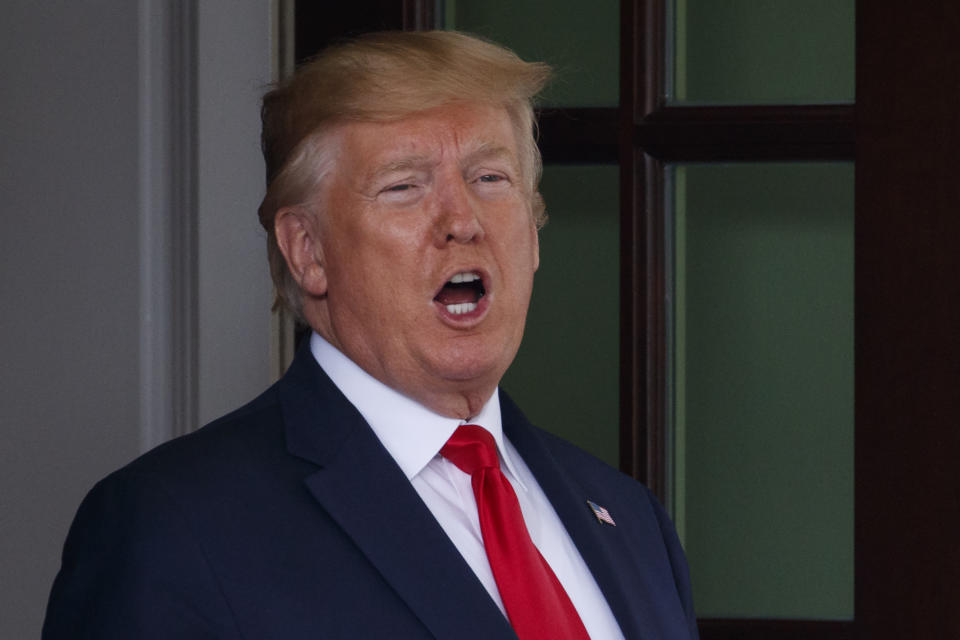 President Donald Trump calls to the media as he waits to greet Dutch Prime Minister Mark Rutte as he arrives at the White House in Washington, Thursday, July 18, 2019. (AP Photo/Carolyn Kaster)