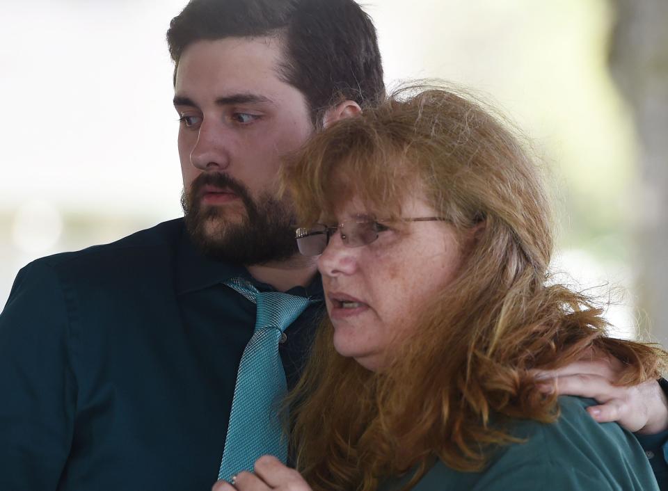 Jessica Hiatt's mother Sara Spangler and brother Ian Hiatt console each other during her celebration of life service Monday, May 16, 2022, in Slater, Iowa.