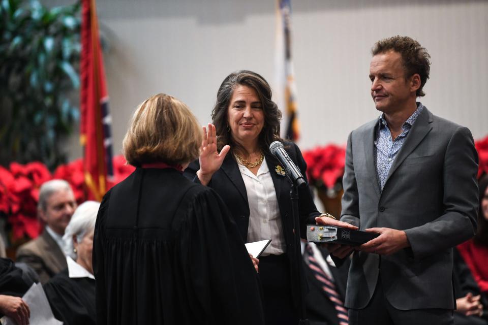 Mayor Indya Kincannon stands next to her husband Ben Barton as she is sworn in for a second term by Tennessee State Supreme Court Justice Sharon Lee on Dec. 16.