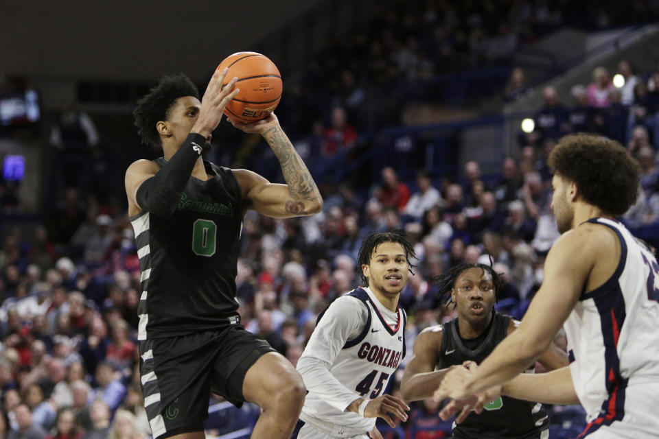 Chicago State guard Elijah Weaver (0) drives while defended by Gonzaga forward Anton Watson, right, during the second half of an NCAA college basketball game, Wednesday, March 1, 2023, in Spokane, Wash. Gonzaga won 104-65. (AP Photo/Young Kwak)