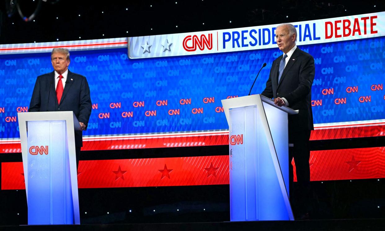 <span>Former president Donald Trump (left) and US president Joe Biden participate in a presidential debate in Atlanta, Georgia, on 27 June 2024.</span><span>Photograph: Andrew Caballero-Reynolds/AFP/Getty Images</span>