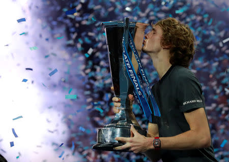 Tennis - ATP Finals - The O2, London, Britain - November 18, 2018 Germany's Alexander Zverev celebrates by kissing the trophy after winning the final against Serbia's Novak Djokovic Action Images via Reuters/Andrew Couldridge