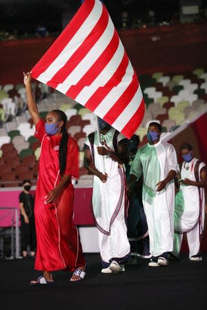 Flag bearers Ebony Morrison and Joseph Fahnbulleh of Team Liberia during the Opening Ceremony of the Tokyo 2020 Olympic Games at Olympic Stadium on July 23, 2021 in Tokyo, Japan.