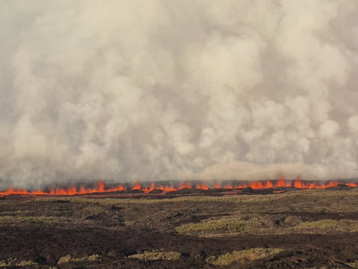 This photo released by the the National Galapagos Park communications office shows lava spreading from the eruption of Wolf Volcano on Isabela Island, Galapagos Islands, Ecuador, Friday, Jan. 7, 2022. (Wilson Cabrera/National Galapagos Park communications office via AP)