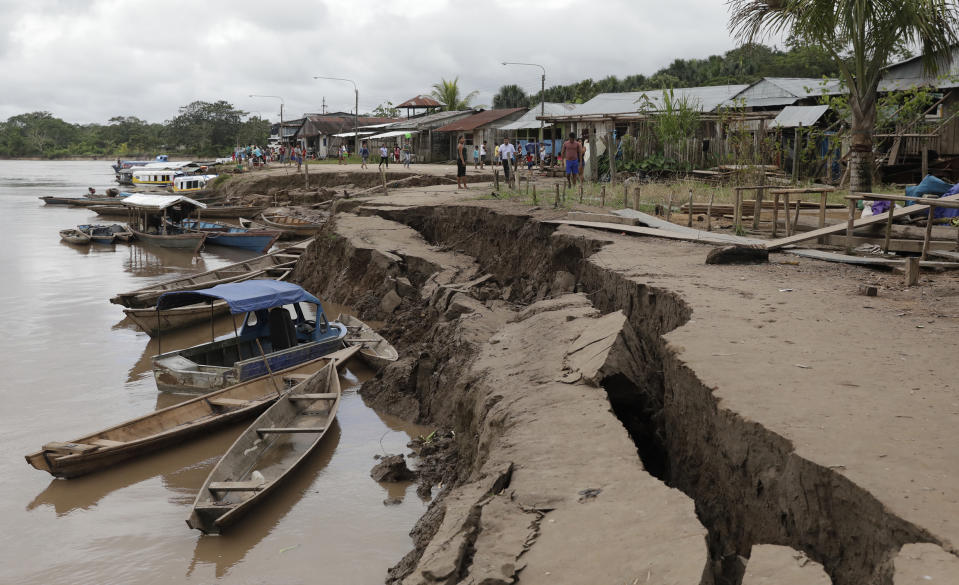 The banks of the Huallaga River are cracked after an earthquake in Puerto Santa Gema, on the outskirts of Yurimaguas, Peru, Sunday, May 26, 2019. A powerful magnitude 8.0 earthquake struck this remote part of the Amazon jungle in Peru early Sunday, collapsing buildings and knocking out power to some areas. (Guadalupe Pardo/Pool photo via AP)