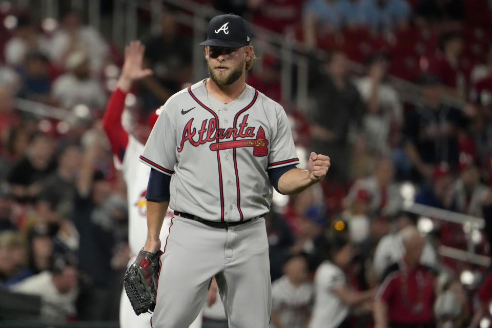 Atlanta Braves relief pitcher A.J. Minter pumps his fist after getting St. Louis Cardinals' Dylan Carlson to fly out ending a baseball game Monday, April 3, 2023, in St. Louis. (AP Photo/Jeff Roberson)