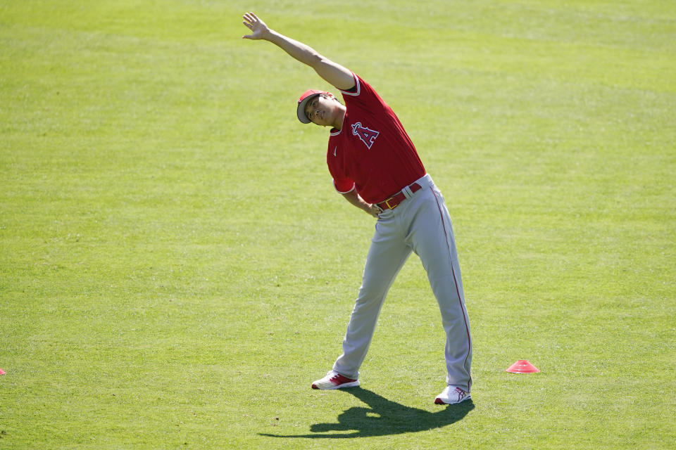 Los Angeles Angels designated hitter Shohei Ohtani (17) stretches during a baseball practice at Angels Stadium on Friday, July 3, 2020, in Anaheim, Calif. (AP Photo/Ashley Landis)