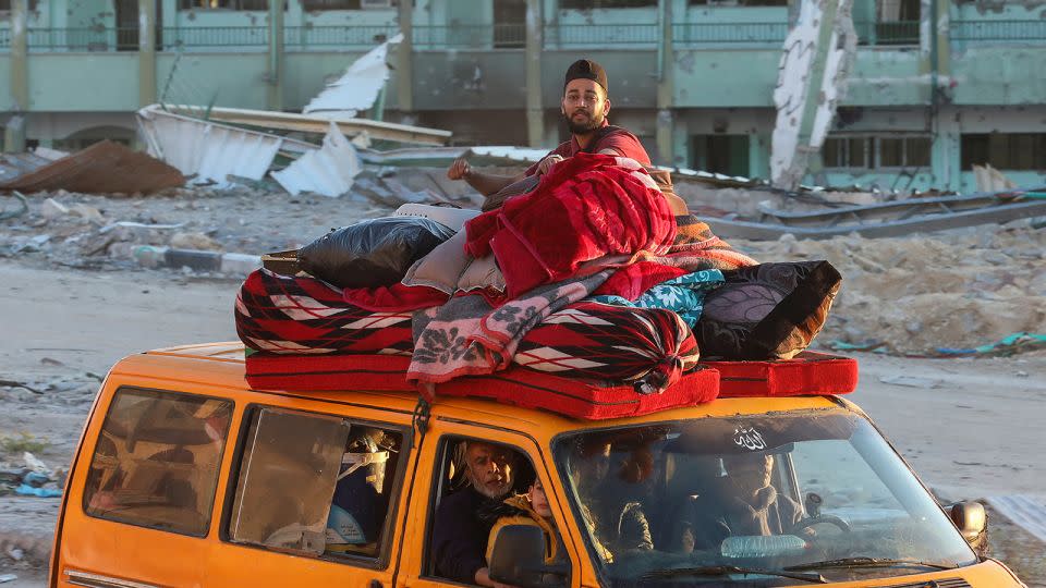 A displaced Palestinian, who fled Rafah after the Israeli military ordered the evacuation of civilians, sits on a vehicle, in Khan Younis in southern Gaza on May 6, 2024. - Ramadan Abed