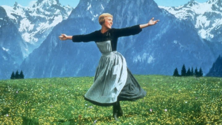 Julie Andrews as Maria spreading her arms in the alps in The Sound of Music.
