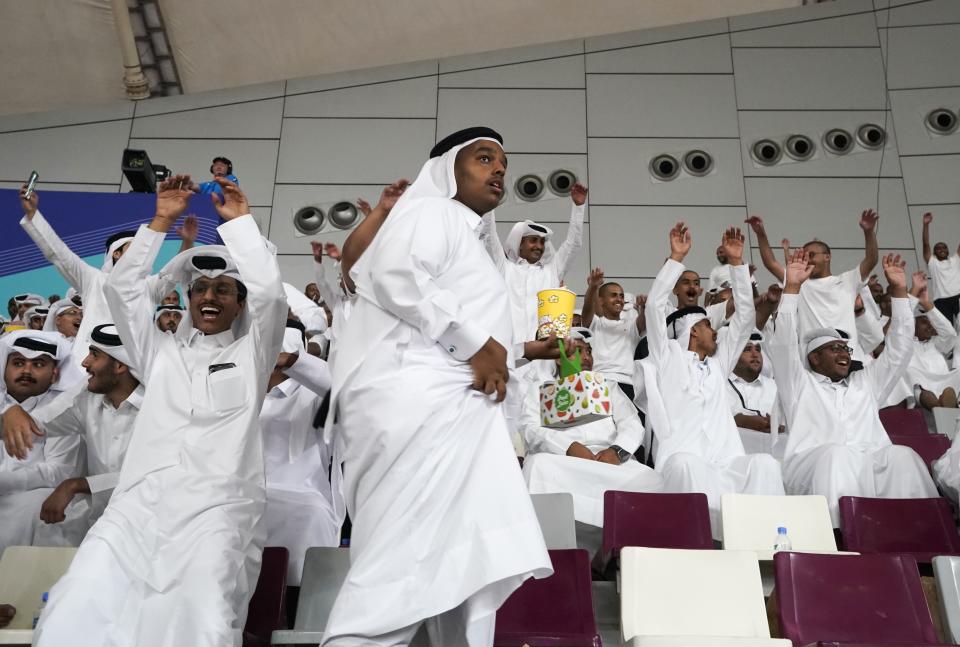 Fans cheer during a break at the World Athletics Championships in Doha, Qatar, Thursday, Oct. 3, 2019. (AP Photo/Morry Gash)