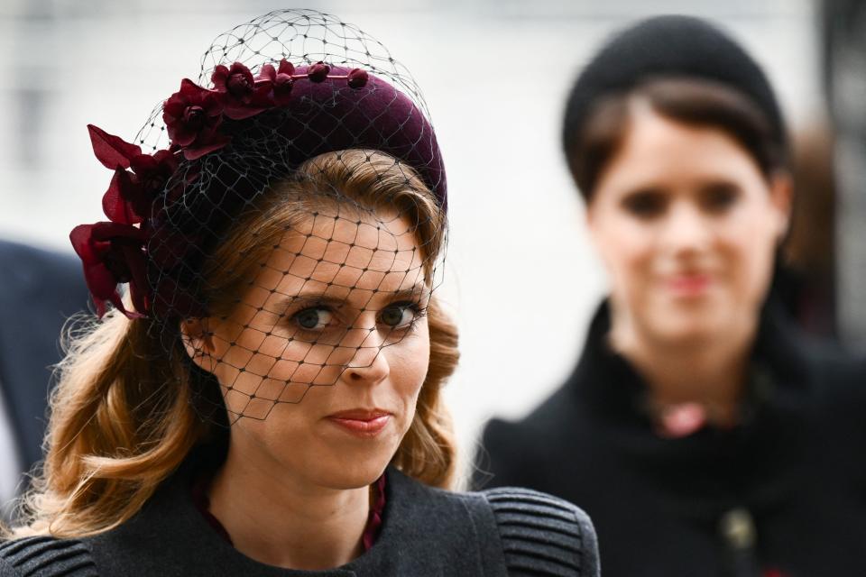 Britain's Princess Beatrice of York (L) and her sister Britain's Princess Eugenie of York arrive to attend a Service of Thanksgiving for Britain's Prince Philip, Duke of Edinburgh, at Westminster Abbey in central London on March 29, 2022. - A thanksgiving service will take place on Tuesday for Queen Elizabeth II's late husband, Prince Philip, nearly a year after his death and funeral held under coronavirus restrictions. Philip, who was married to the queen for 73 years, died on April 9 last year aged 99, following a month-long stay in hospital with a heart complaint. (Photo by Daniel LEAL / AFP) (Photo by DANIEL LEAL/AFP via Getty Images)