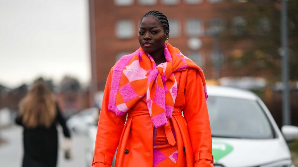 Woman wearing a red trench coat 