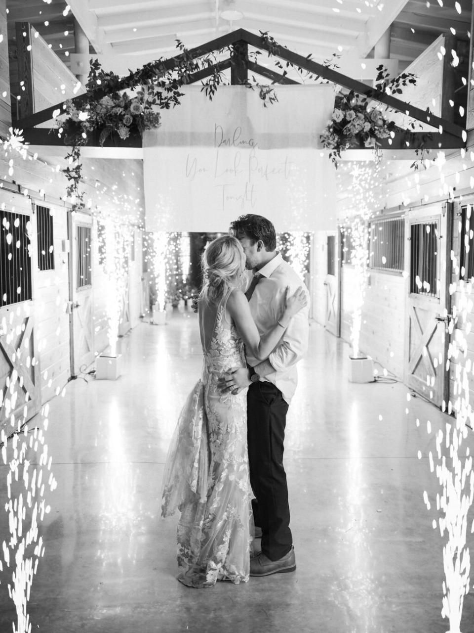 wedding couple kissing with sparklers