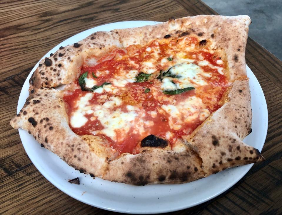 Margherita pizza goes well with the porlezza at Il Forno.