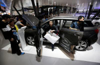 Visitors exit a Haval H6 from Great Wall Motors during the Auto China 2016 auto show in Beijing, China May 4, 2016. REUTERS/Jason Lee