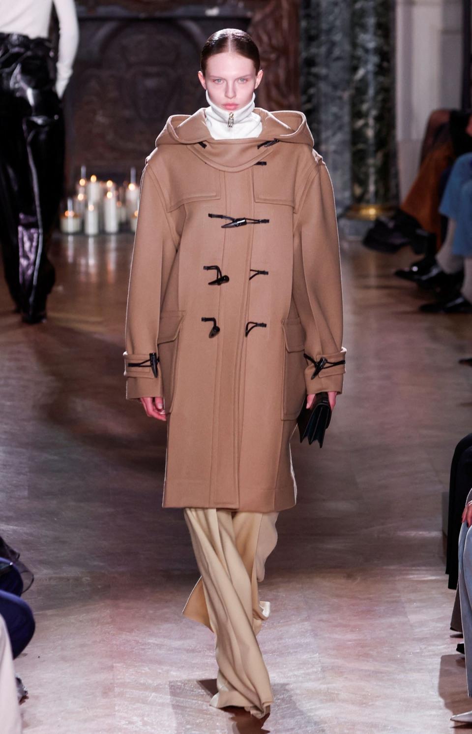 A model wearing a Victoria Beckham duffle coat at her Paris Fashion Week show (REUTERS)