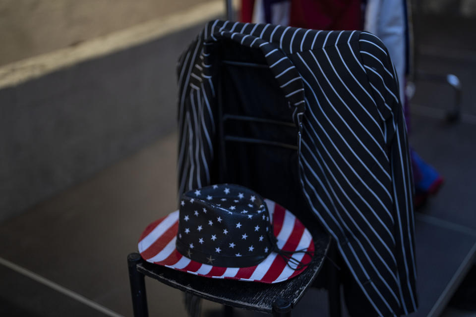 A US flag-themed cowboy hat and a suit jacket are placed on a chair at the backstage of the Odeon of Herodes Atticus for a performance of "Madame Butterfly" in Athens, on Friday, June 1, 2023. The annual arts festival in Athens and at the ancient theater of Epidaurus in southern Greece is dedicated this year to the late opera great Maria Callas who was born 100 years ago. (AP Photo/Petros Giannakouris)