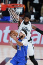 Dallas Mavericks' Seth Curry (30) drives against Los Angeles Clippers' Paul George (13) during the first half of an NBA basketball first round playoff game Friday, Aug. 21, 2020, in Lake Buena Vista, Fla. (AP Photo/Ashley Landis, Pool)