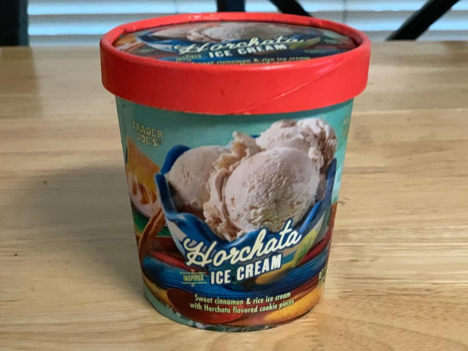 A colorful carton of Trader Joes horchata ice cream on table