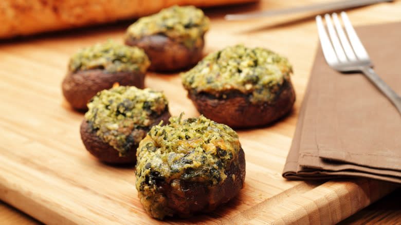 Stuffed mushrooms on cutting board