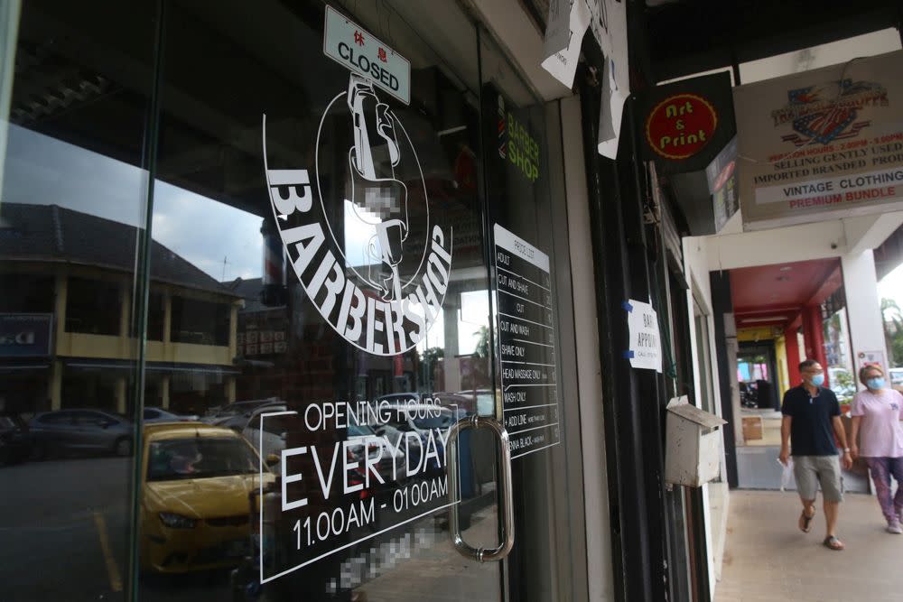 Barbers, hairdressers, and personal grooming businesses are finally allowed to resume operations amid tight regulations beginning this Wednesday. — Picture by Choo Choy May