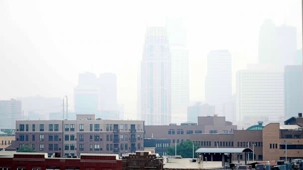 PHOTO: Haze envelopes the Minneapolis skyline from smoke drifted over from the wildfires in Canada, June 14, 2023, in Minneapolis. (Abbie Parr/AP)