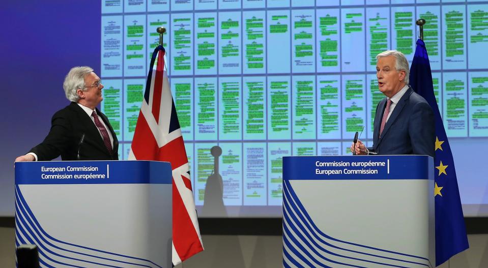 UK Brexit Secretary David Davis and EU chief Brexit negotiator Michel Barnier present the draft Withdrawal Agreement, which does not currently include continued freedom of movement (Getty)