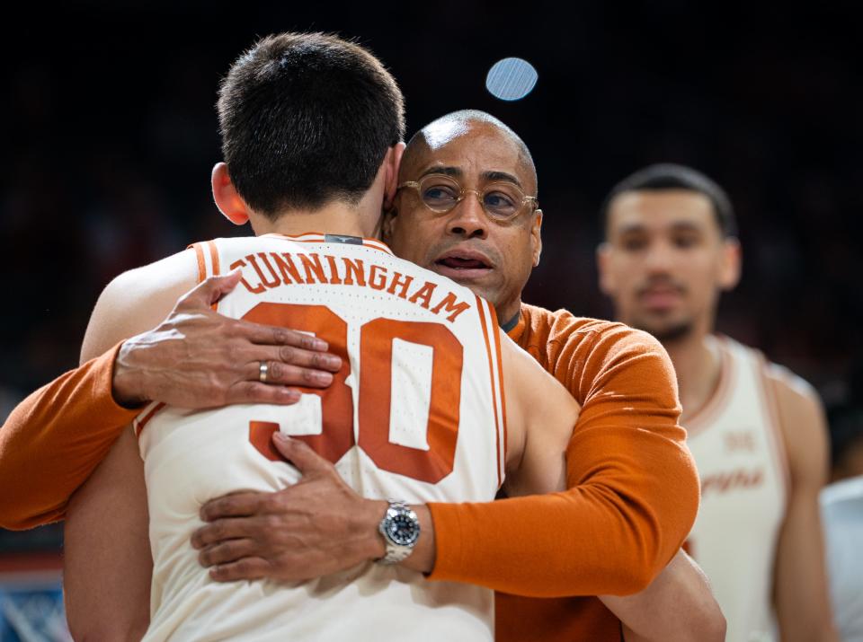 Texas head coach Rodney Terry hugs forward Brock Cunningham ahead of the veteran Longhorn's final home game at Moody Center last Saturday. Cunningham played at nearby Westlake High School before signing with Texas, where his father played college football.