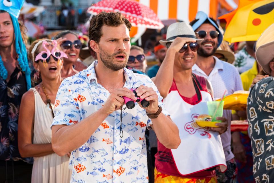 Playing Edgar in "Barb & Star Go to Vista Del Mar," Jamie Dornan got to wear a whole lot of Hawaiian shirts. "The fitting was very fun because I loved everything I put on," he says. "I only ended up with one (Hawaiian shirt). It has a fish on it. Come the summer, I’ll rock that."