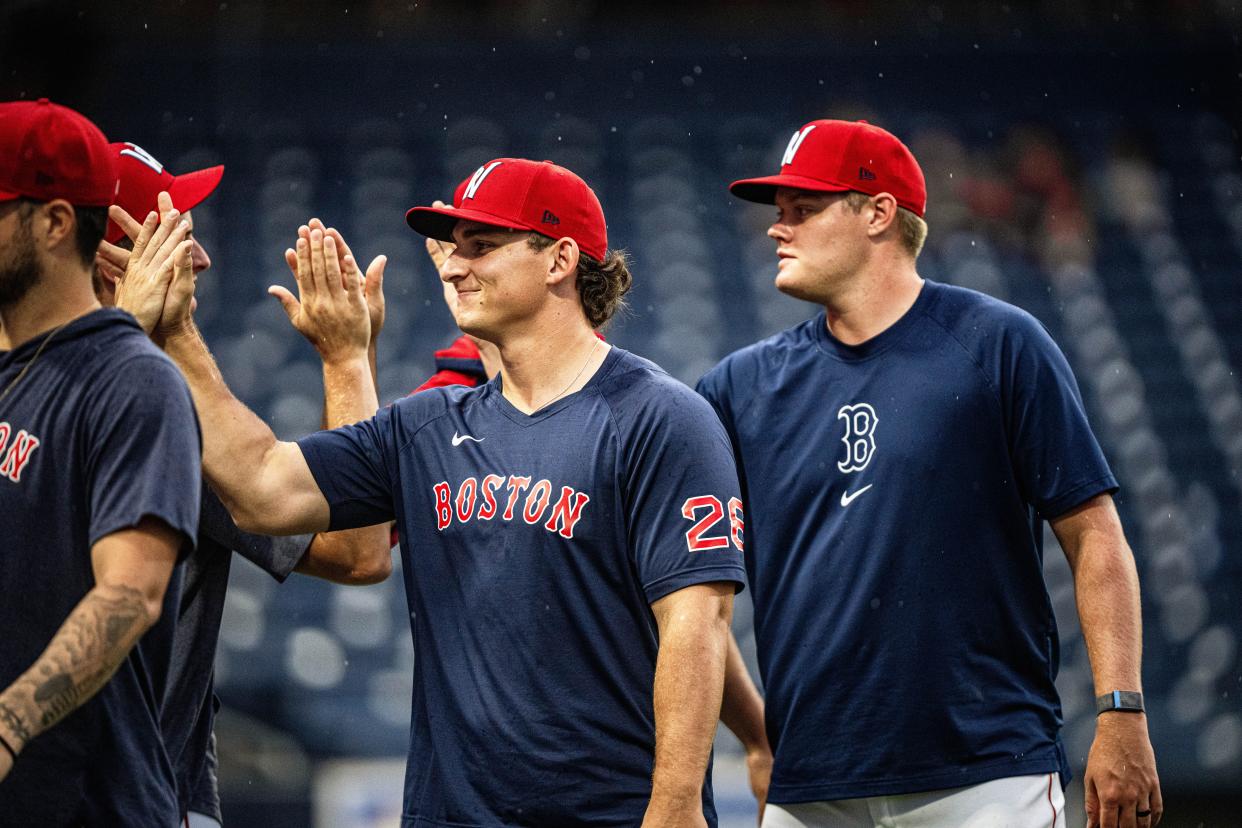 Worcester Red Sox pitcher Zach Penrod (left) smirks following his team's win over the Buffalo Bisons on Aug. 3, 2024, at Polar Park.