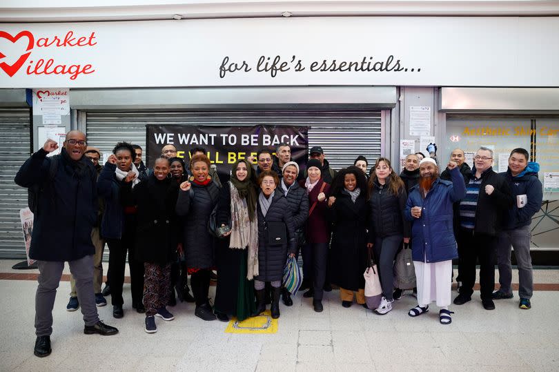 Traders and local councillors outside the entrance of Stratford Market Village