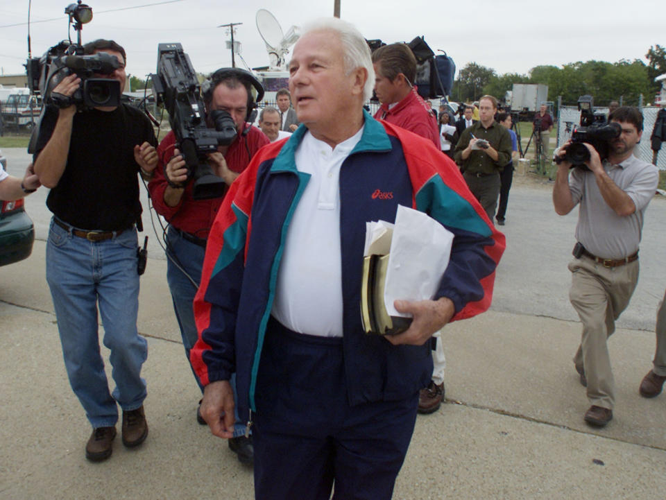 FILE - In this Oct. 21, 2002 file photo, former Louisiana Gov. Edwin Edwards walks to his car outside the Federal Medical Center in Fort Worth, Texas, after talking with reporters before checking into the prison. Edwards, the high-living four-term governor whose three-decade dominance of Louisiana politics was all but overshadowed by scandal and an eight-year federal prison stretch, died Monday, July 12, 2021, of respiratory problems. He was 93. (AP Photo/Donna McWilliam, File)