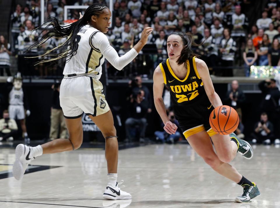 Purdue Boilermakers guard Jayla Smith (3) defends Iowa Hawkeyes guard Caitlin Clark (22) during the NCAA women’s basketball game, Wednesday, Jan. 10, 2024, at Mackey Arena in West Lafayette, Ind.