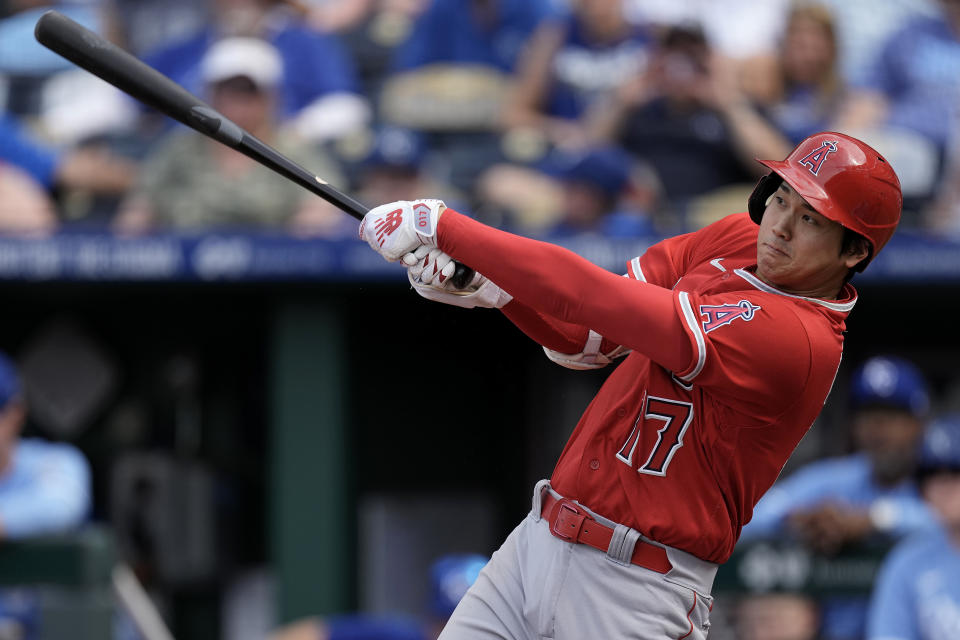 Los Angeles Angels' Shohei Ohtani, from Japan, watches his solo home run during the seventh inning of a baseball game against the Kansas City Royals Saturday, June 17, 2023, in Kansas City, Mo. (AP Photo/Charlie Riedel)