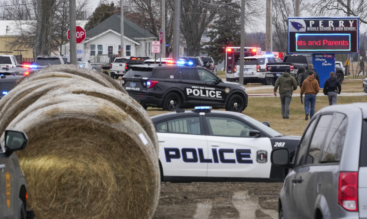 Police respond to the scene of a shooting at Perry High School in Perry, Iowa, Thursday. (Andrew Harnick/AP)
