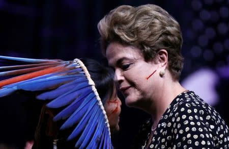 Brazil's President Dilma Rousseff (R) greets an indigenous woman during the Opening ceremony of the National Policy Conference for Women in Brasilia, Brazil, May 10, 2016. REUTERS/Ueslei Marcelino