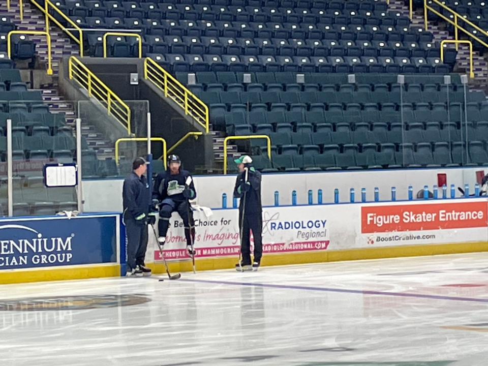 Former NHL player and two-time Stanley Cup champion Trevor Daley, a 38-year-old defenseman (center) sits before a pregame skate on Friday, Jan. 7, 2022 at Hertz Arena. Daley signed with the Florida Everblades on Thursday after the club lost a handful of players due to COVID-19 protocols. Former coach Greg Poss, right, is coaching the Blades this weekend because head coach Brad Ralph also is in protocols, and former star Ernie Hartlieb, left, is filling the assistant coach's role for the same reason.