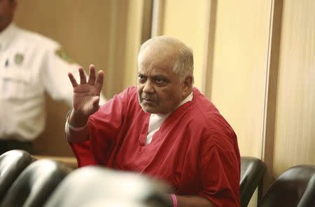 Krishna Maharaj gestures in Circuit Court during a legal hearing in Miami, Florida, November 10, 2014. REUTERS/ Chris Bott/Pool