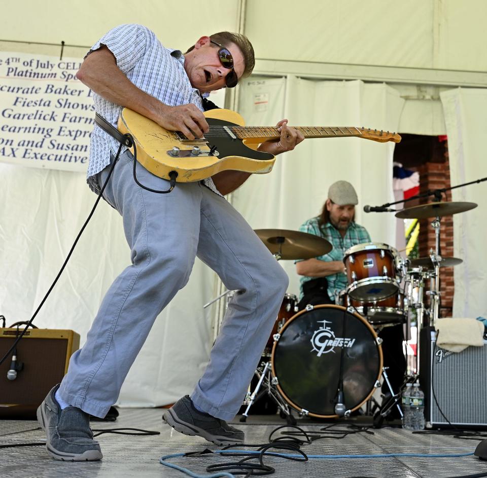 Neal Vitullo, of the Providence blues band Neal and the Vipers, cuts loose on his guitar during the second annual Franklin Blues Festival, part of Franklin's annual five-day Fourth of July festivities, on Franklin Town Common, July 2, 2022. The celebration continues through Monday on the Common.