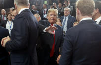 <p>President Trump pats a world leader on the back as he makes his way to his seat for a meeting of the North Atlantic Council during a summit of heads of state and government at NATO headquarters in Brussels on Wednesday, July 11, 2018. (Photo: Pablo Martinez Monsivais/pool/AP) </p>